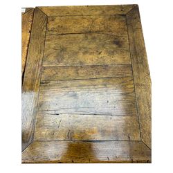 Early 20th century Jacobean design draw-leaf oak dining table, rectangular top with carved frieze depicting scrolling foliage and grape clusters, sliding extending leaves, raised on robust turned supports united by H-stretcher  