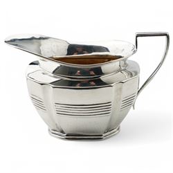 Late Victorian silver three piece tea set of panel sided oval design, the teapot with ebonised handle and lift, Chester 1898/99 Maker Florence Warden and William Aitken