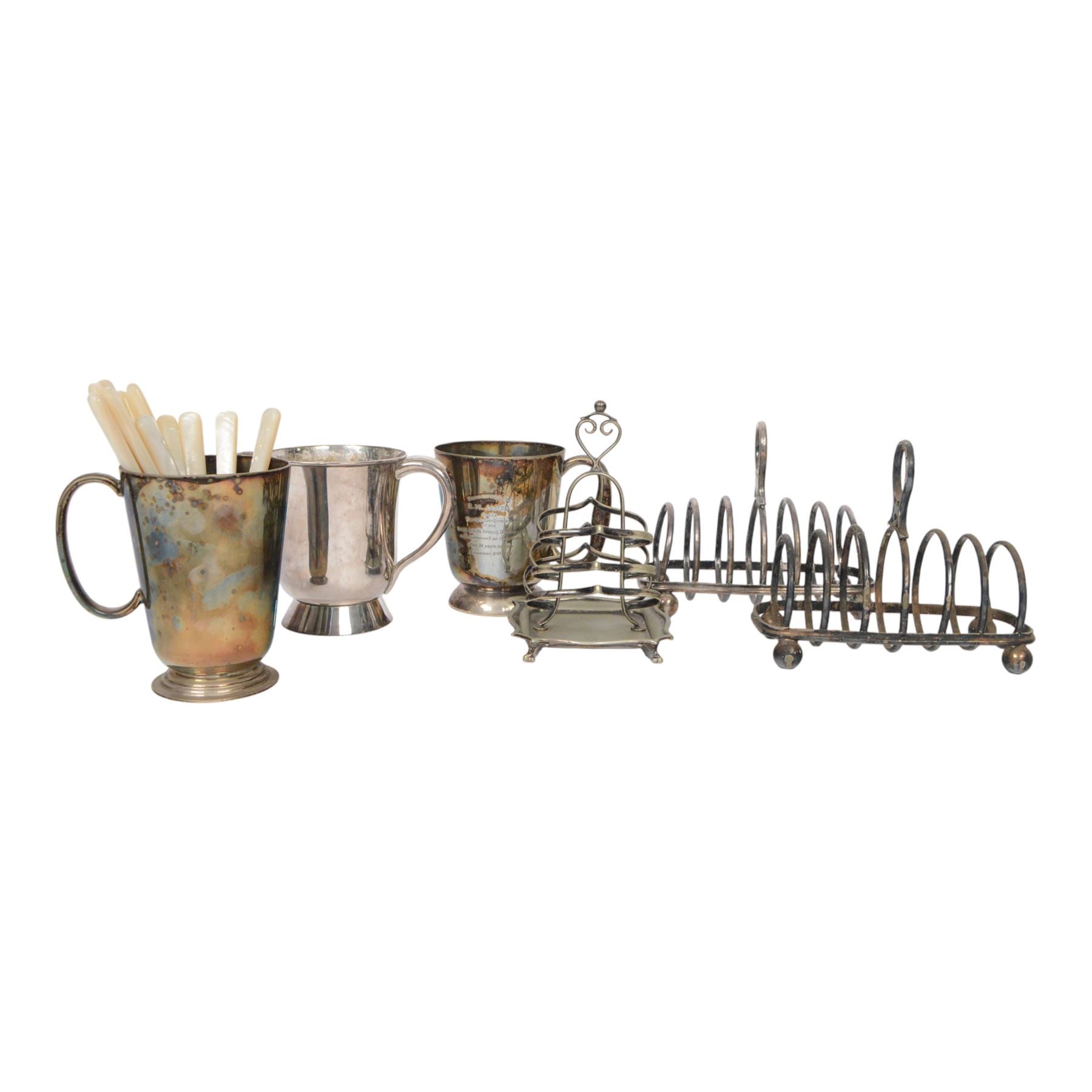 Set of six fruit knives and forks, with mother of pearl handles and silver collar, together with three silver plated toast racks, Askew twin handled tankard and two others   