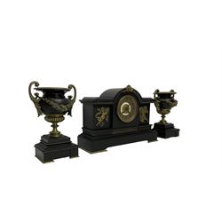French - late 19th century 8-day mantle clock with garnitures in a break front Belgium slate case, with a break arch top and ornamental brass relief in the form of cherubs representing music and literature, on a deep plinth with padded feet, two part gilt dial with a pierced  filigree centre and Arabic numerals, rack striking movement, striking the hours and half hours on a coiled gong, with matching garnitures in the  form of urns on a raised plinth. With pendulum and key.  