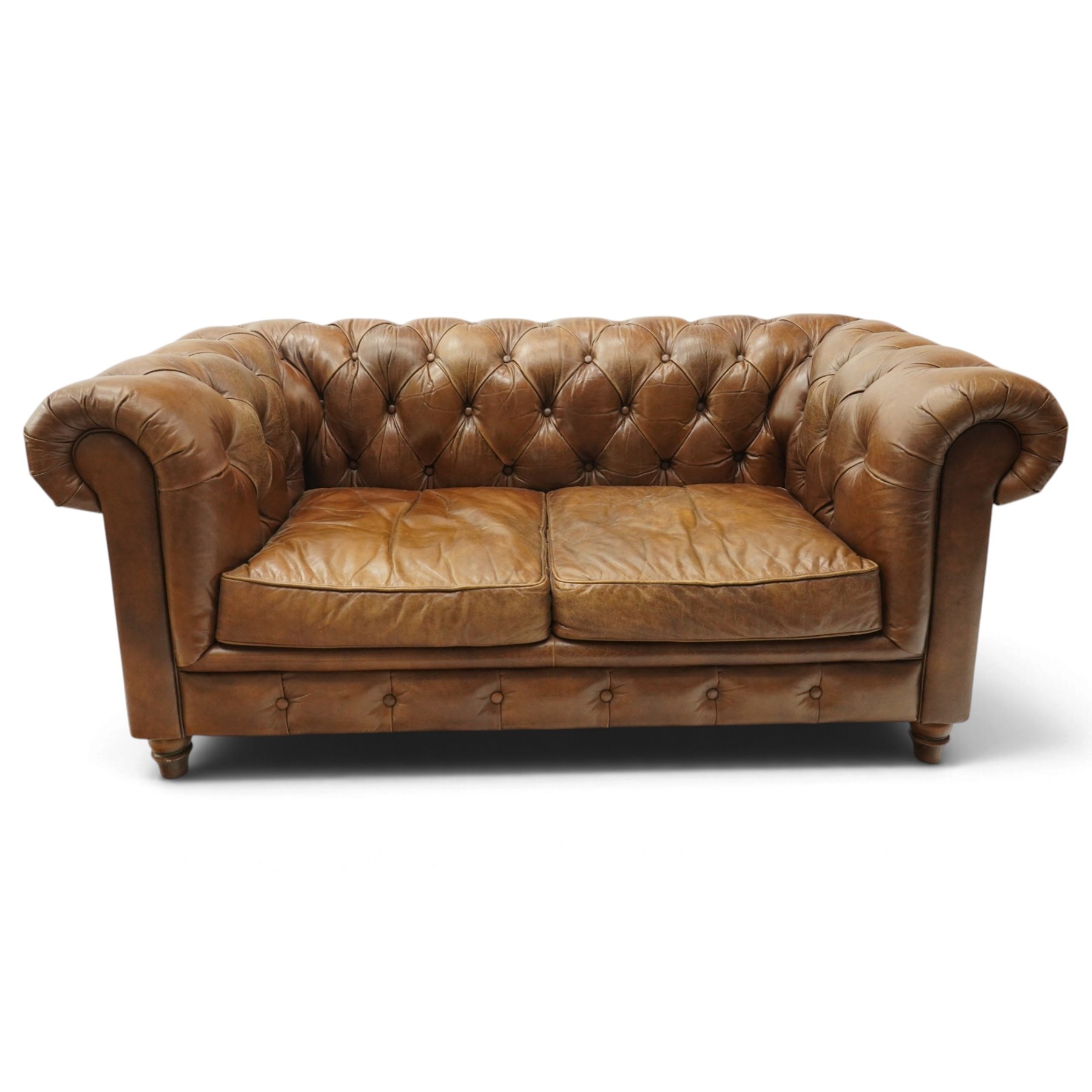 Timothy Oulton for Halo - two seater brown leather chesterfield settee, of traditional shape with rolled back and arms, upholstered in back-buttoned tan leather with loose seat cushions, raised on turned feet