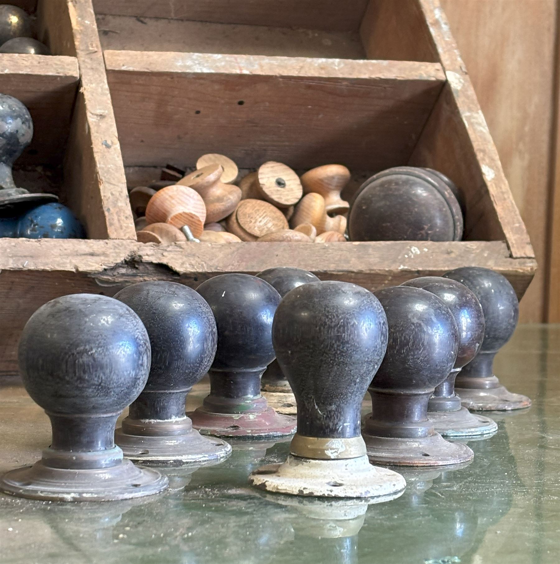 Group of vintage and antique hardware and door furniture, to include a near set of eight ebony door handles, gilt brass curtain pole finials etc.  - COLLECTION BY APPOINTMENT FROM: The White House, Thirsk Road, Easingwold, York, YO61 3NF - CALL 01723 507111 TO ARRANGE