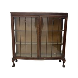 Early 20th century mahogany display cabinet, bow front, fitted with two doors, ball and claw feet, and a mid-20th century walnut circular  occasional table