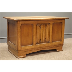  Mid 20th century oak blanket box, planked top with linenfold centre panel front on bracket feet, W92cm, H55cm, D48cm  