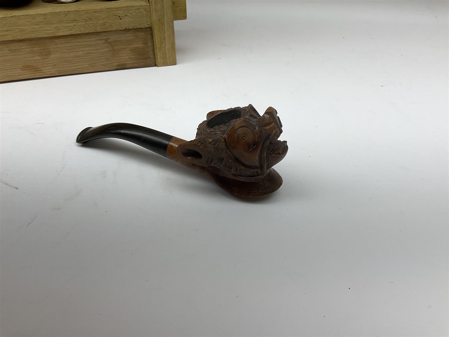 Pipes and two tiered wooden rack together with eleven pipers, including briar pipe carved as a wolf, Sea Dog straight pipe, John Brumfit pipe, meerschaum pipe ect, pipe rack H29.5cm