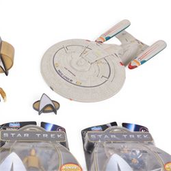 Four carded Playmates Star Trek figures, comprising Ensign Harry Kim, Galaxy Collection Kirk, Original Spock and Spock, together with a small collection of loose Star Trek models and star ships