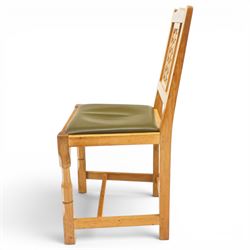 Beaverman - 1980s set of four lattice back dining chairs, shaped top rail above a lattice back, green leather fixed seat, raised on octagonal front supports, with carved Beaver to the back stretcher, by Colin Almack of Sutton near Thirsk