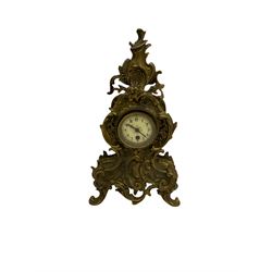 A tall gilt metal mantle clock in a rococo style case c1900, with a French spring driven single train timepiece movement and recoil anchor escapement, cream enamel dial with upright Arabic numerals, minute markers and steel fleur de Lis hands, brass bezel with a flat bevelled glass. With pendulum.



