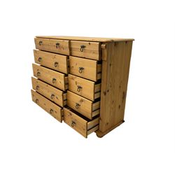 Pine chest, fitted with five short and five long drawers flanked by fluted uprights, on compressed bun feet