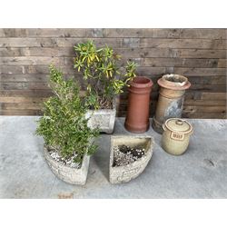 Two cast stone corner planters, square planter other Yorkshire Rose, two terracotta chimney pots and a terracotta bread bin (6)