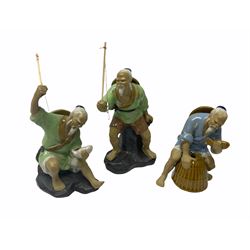 Three ceramic figures, modelled as Chinese fishermen 