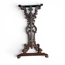 Pair of Victorian cast iron table end supports, of pierced and scrolling foliate design with central masks, united by X-form stretcher, with later top