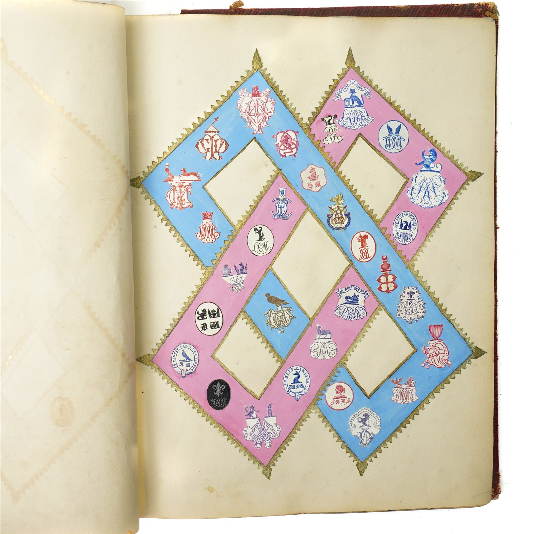 Victorian scrap book intricately worked with scraps heightened in watercolour with crests, military subjects and others on sixty five pages