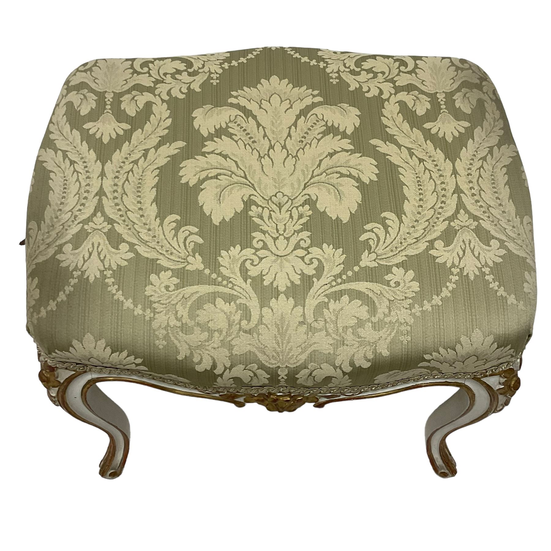 20th century French design parcel gilt and painted dressing table stool, upholstered in sage green damask fabric, shaped form on floral carved cabriole supports, with matching cushion 