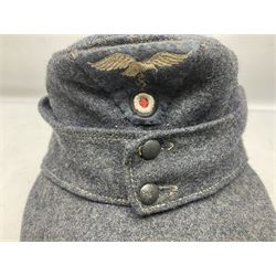 WW2 German Luftwaffe M43 field cap with triangular cloth eagle and roundel badge; marked '1944 ?/0501/0015 57'
