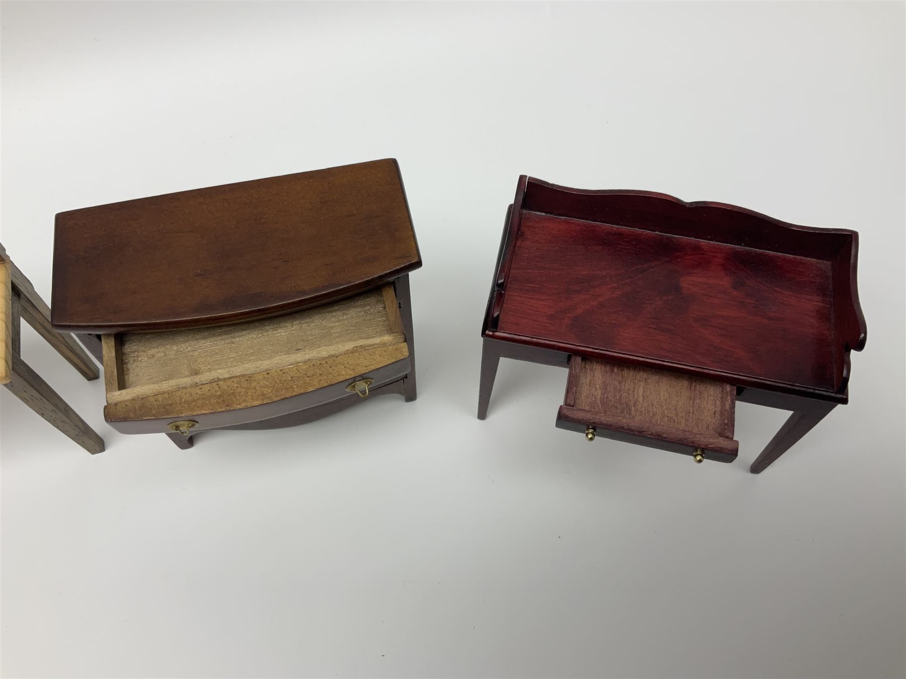 Collection of miniature dolls house furniture and accessories, to include long case clock, chest of drawers, tiled wash stand, ceramics and glass ware, mirror, baskets, etc 