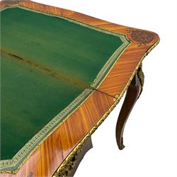 20th century French walnut and Kingwood card table, shaped fold-over top with figured quarter-matched veneers and floral egg and dart moulded edge in gilt metal, shaped aprons decorated with shell motifs with extending foliage, pull-out action base revealing storage well, on cabriole supports with ornate gilt metal mounts 