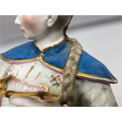 19th century continental figure of a male, modelled with a long braid and holding an opium type pipe in one hand and a flower in the other, his Chinese style dress in blue, pink and white colourway painted with deutschblumen flower sprays, raised upon blue plinth, with gilt detail throughout, with overglaze black crossed swords mark beneath, H38cm