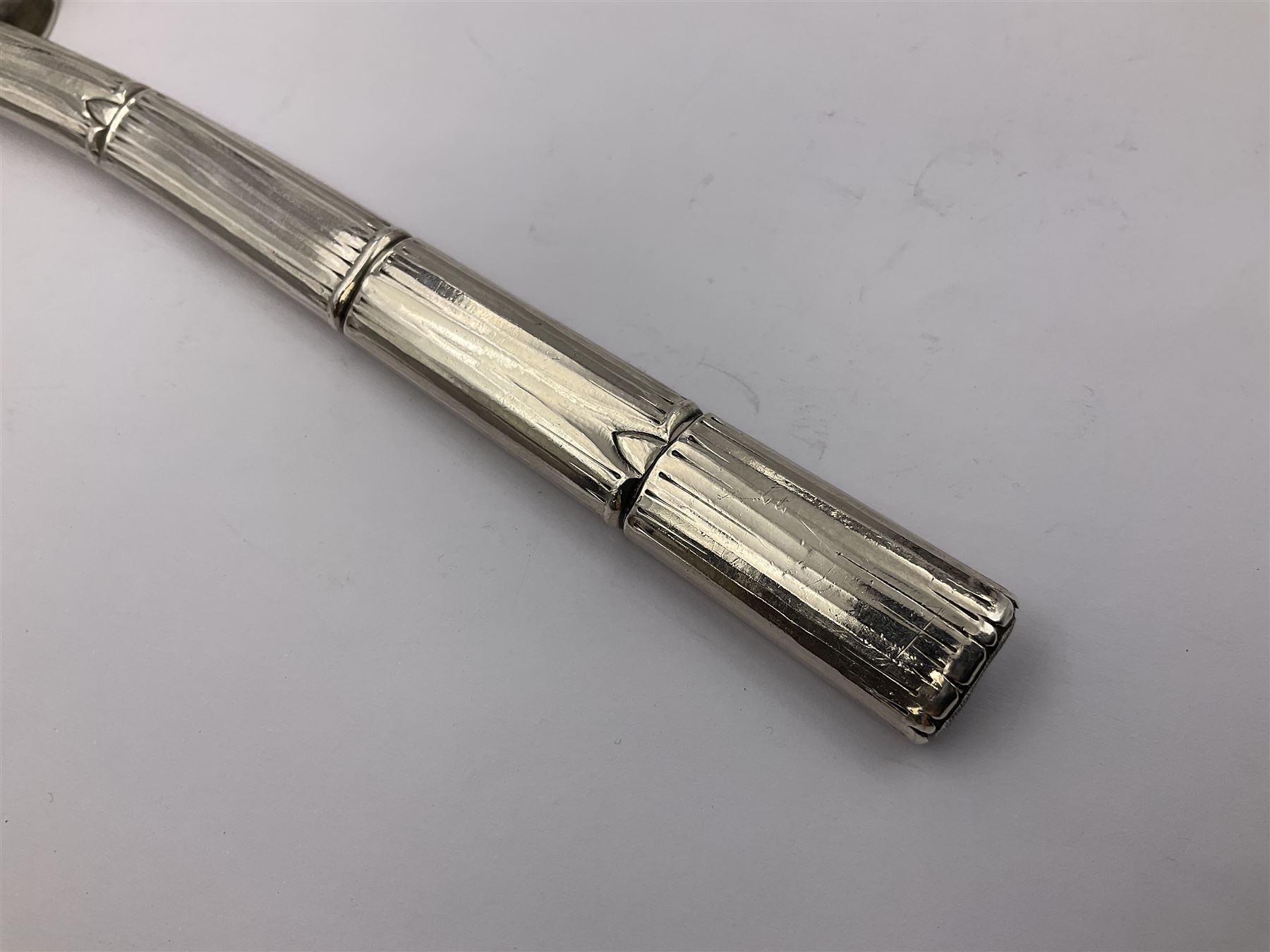 Mid/late 19th century Gorham silver serving spoon, circa 1863-1890, the bowl modelled as an oyster shell with silver gilt interior, affixed to the bamboo handle with silver twine, the bowl with marks for Gorham and impressed Sterling 330, L26.5cm
