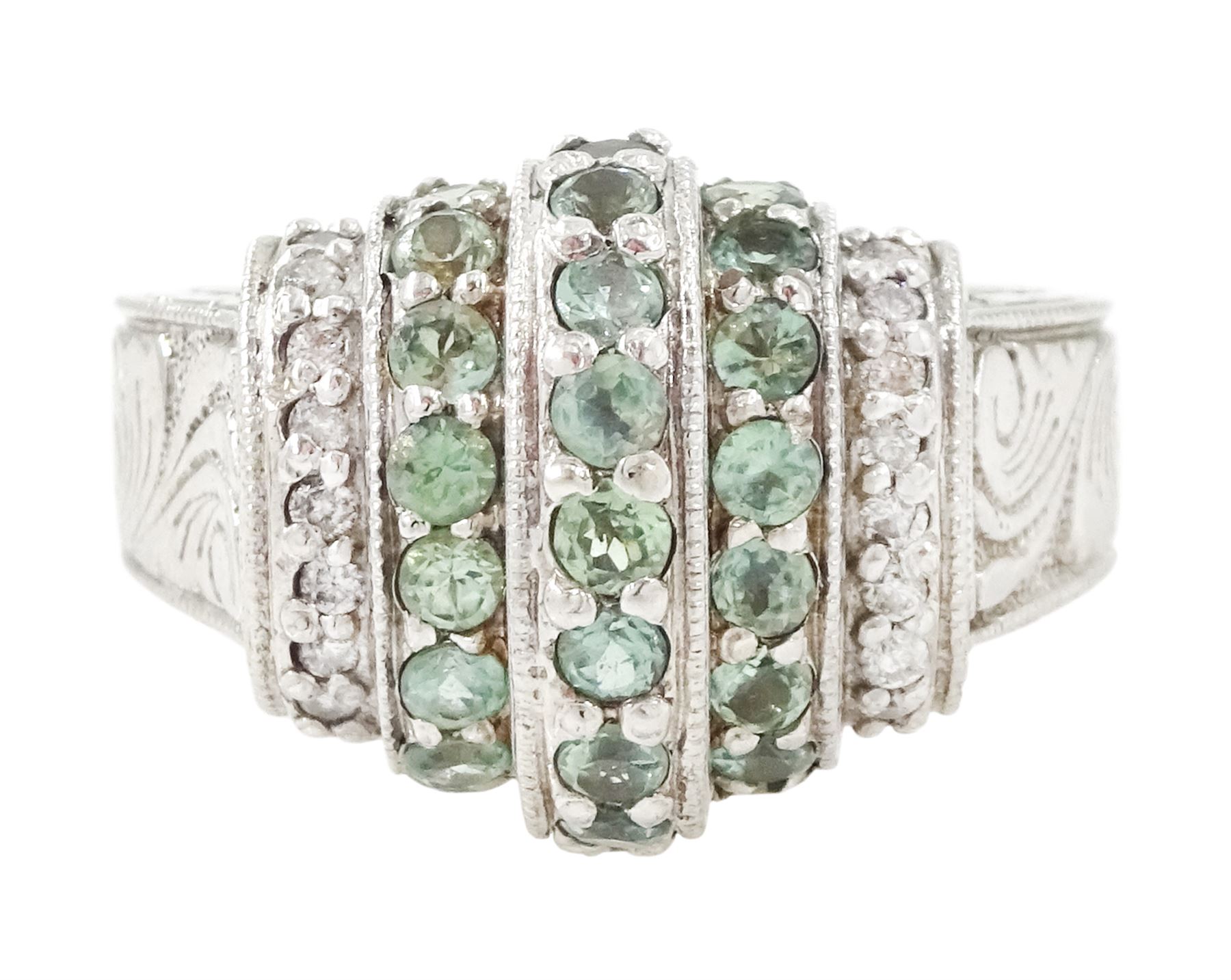 14ct white gold alexandrite and diamond stepped design ring, three rows of round cut alexandrite's, with a row of single cut diamonds either side, the shoulders with engraved foliate decoration, hallmarked