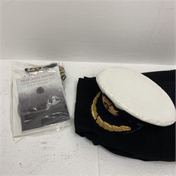 Merchant Navy captain's uniform with WW2 medal ribbons and peaked cap, epaulettes, spare cuff braiding, quantity of buttons and metal badges and two books of maritime interest