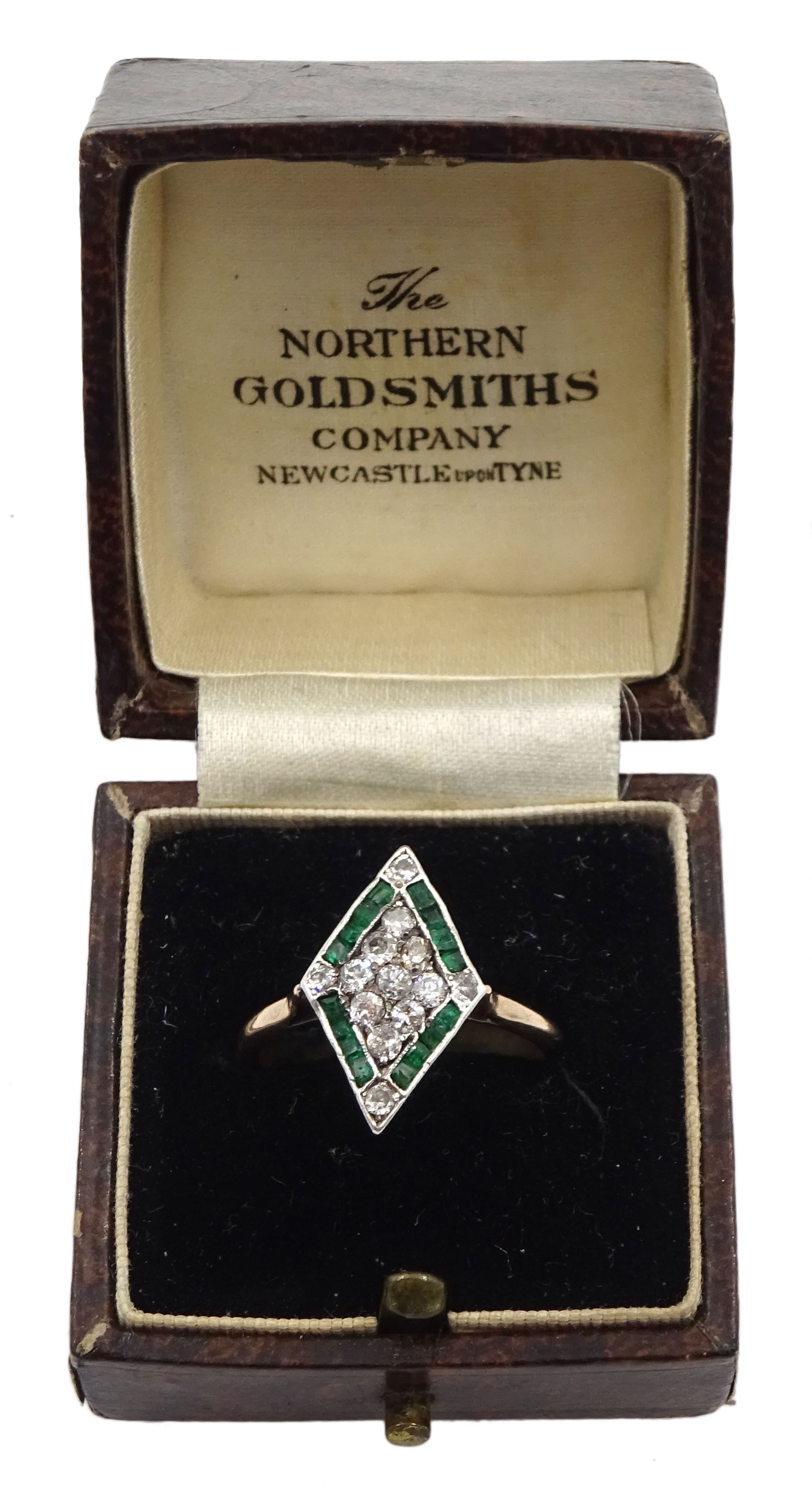 Gold diamond and emerald kite shaped cluster ring, nine old cut diamonds, with calibre cut emerald and diamond set border