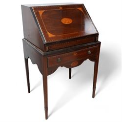 19th century inlaid mahogany bureau on stand, sloped moulded lid inlaid with shell motifs and parquetry bands, the interior fitted with drawers, small cupboard and document divisions, inlaid with soldier holding sword and shield flanked by classical columns, the stand fitted with single drawer over shaped apron inlaid with shell, on square tapering supports  