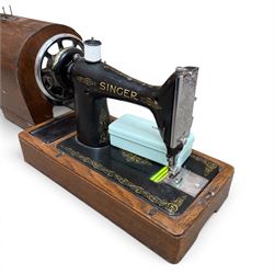 Three Singer wooden cased sewing machines 