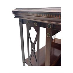 Edwardian inlaid mahogany revolving bookcase, shaped square moulded top with central motif and satinwood band, two tiers with pierced vertical splats, on swivel action base with ceramic castors