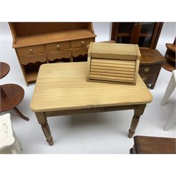 Doll's house wooden furniture - over twenty items including good quality pine Welsh dresser by Tony of Lincoln; tall 'glazed' bookcase; two-tier side cabinet; grand piano; bedside chest, mule chest, Canterbury; cradle; Georgian style hanging corner cupboard; dumb waiter; tables; chairs; rocking chair etc; various scales