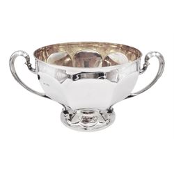 Large Edwardian silver twin handled bowl, the part faceted circular bowl with twin curved handles, upon a spreading circular foot, hallmarked Sibray, Hall & Co Ltd, London 1906, H17.5cm D24.5cm, approximate weight 53.03 ozt (1649.4 grams)