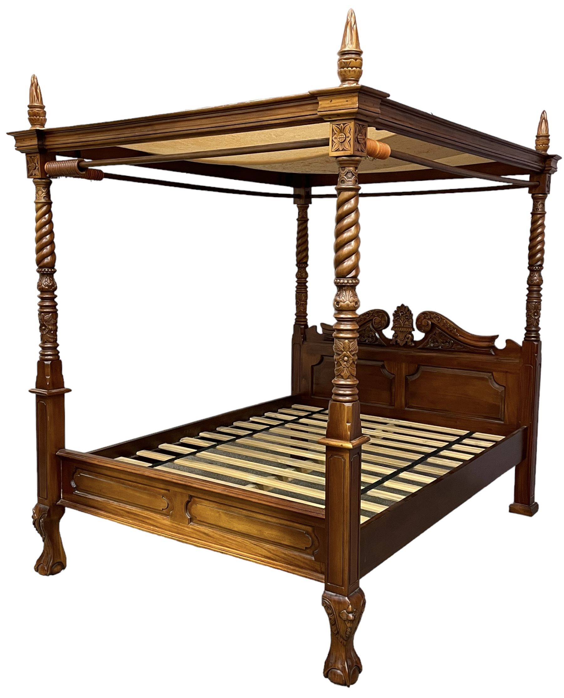 Georgian design mahogany 5' King-size four-poster bed, projecting moulded canopy top on twist-turned columns carved with acanthus leaves and flower heads, the headboard with scrolled broken swan neck pediment carved with scrolled foliage and with central anthemion, on flower head carved ball and claw front feet, with torch and foliate carved pointed finials