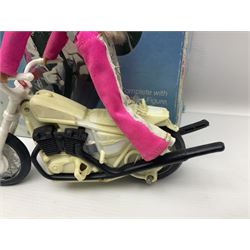 Ideal Derry Daring and Her Trick Cycle, with clothed figure on trick cycle and winder; in original illustrated box dated 1975