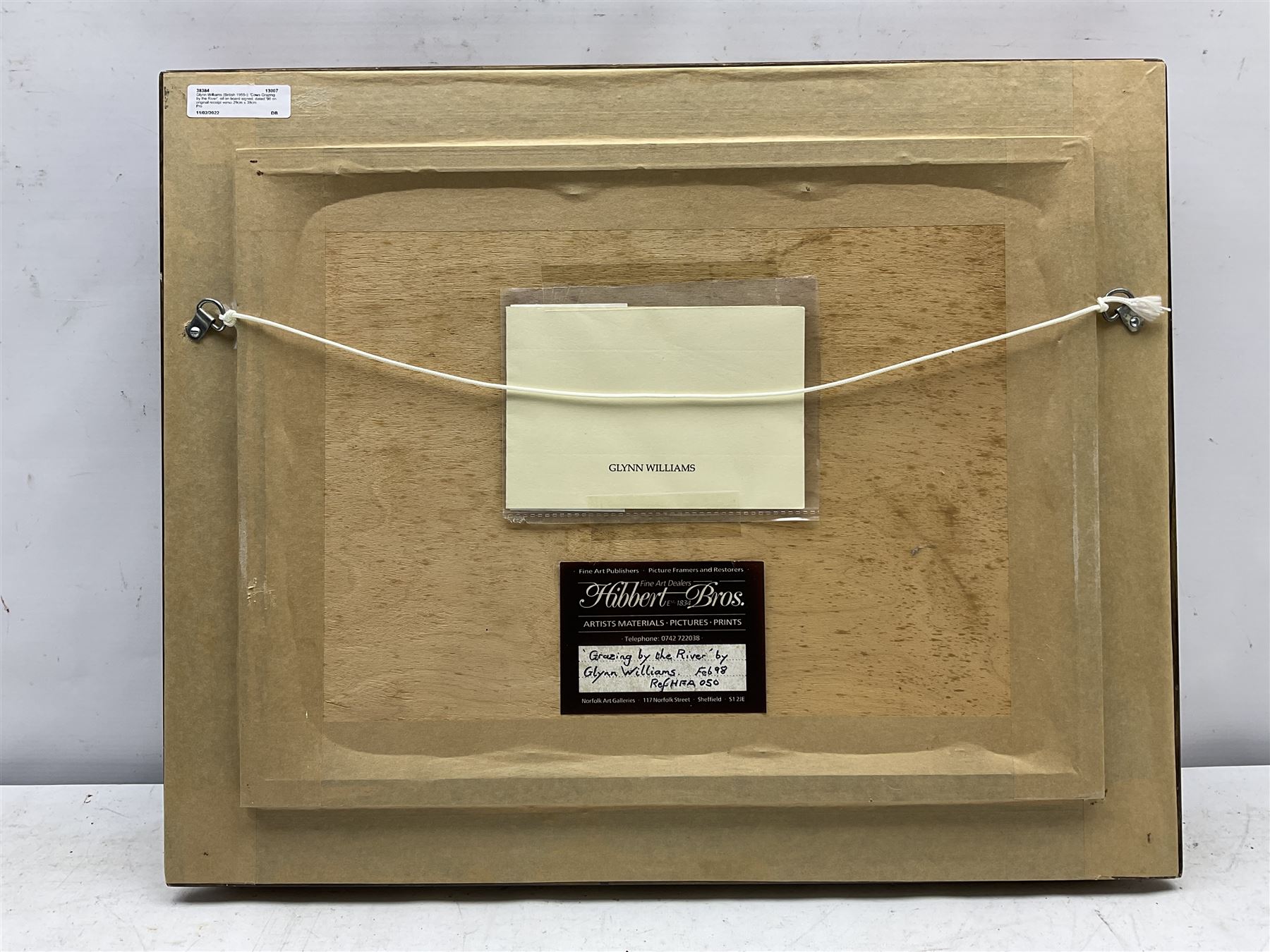 Glynn Williams (British 1955-): 'Cows Grazing by the River', oil on board signed, dated '98 on original receipt 29cm x 39cm
Provenance: with Hibbert Bros., Sheffield, label and receipt verso