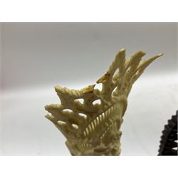 Hardwood bust of an Indoniesian Goddess, carved wearing a pierced headdress, from Klungkung, Bali, H20cm, together with a pair of bone carvings of deity figures, and a carved wood Netsuke in the form of a Chinese dragon