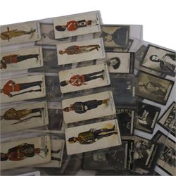 Collection of military cigarette cards, including Churchmans cigarette cards and Ogden's Guinea Cold Cigarettes