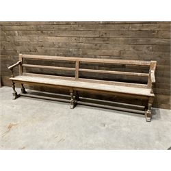 Victorian pitch pine bench pew, turned arms and legs, rail back with plank seat, 274cm
