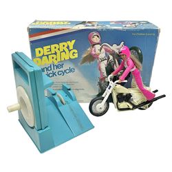 Ideal Derry Daring and Her Trick Cycle, with clothed figure on trick cycle and winder; in original illustrated box dated 1975