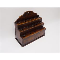 George III boarded oak spoon rack, with shaped pediment over three stepped tiers, each with five apertures, H34cm L38cm D17cm