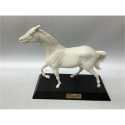 Collection of Beswick figures comprising horses head and horseshoe wall plaques, no.806 and 807 and three Beswick white matte glazed horses by Graham Tongue, comprising ‘Spirit of Fire’, ‘Adventure’ and ‘Spirit of the Wind’ (a/f), all marked beneath (5)