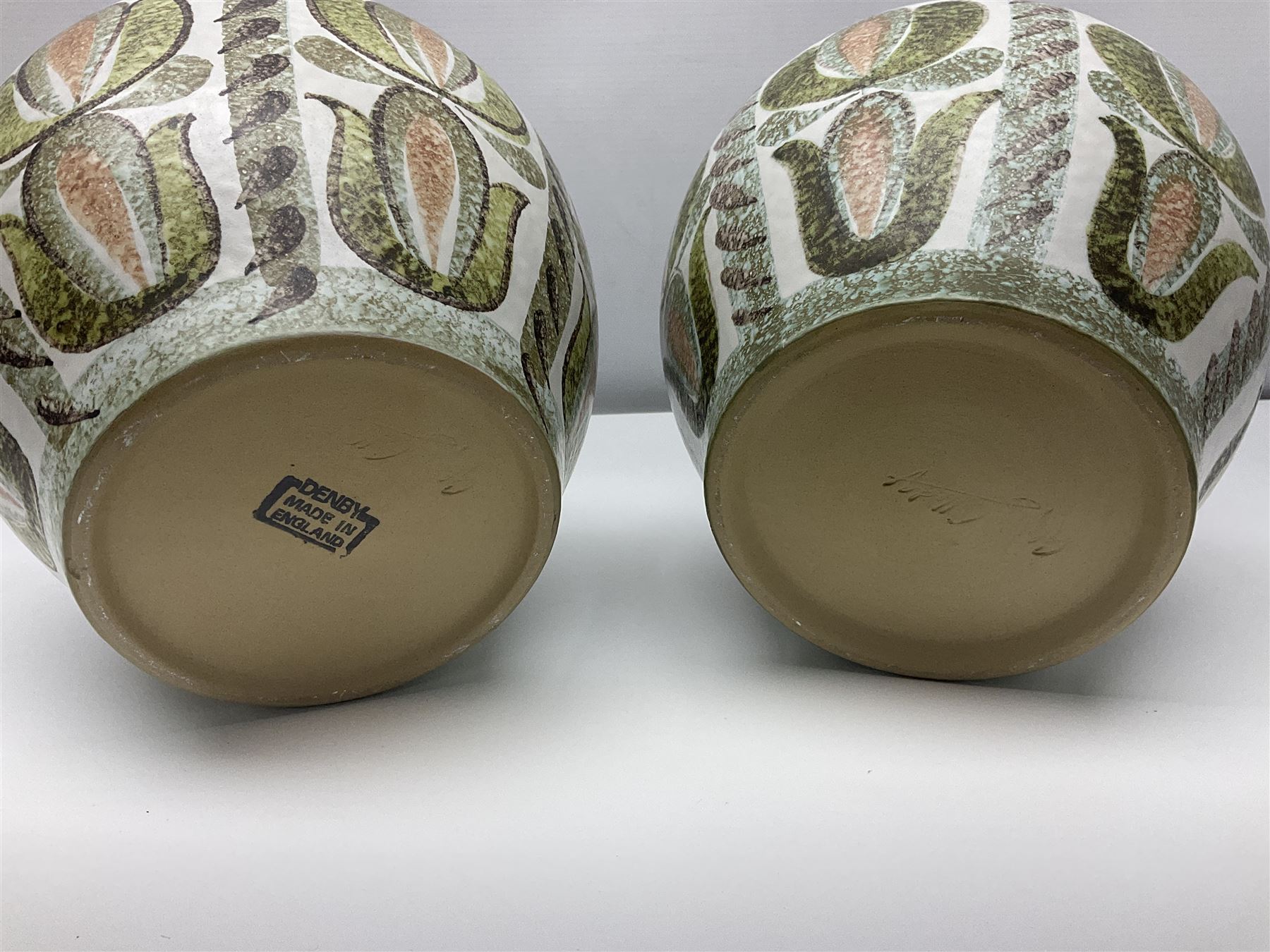 Pair of Denby Glyn Colledge stoneware vases of baluster form with floral decoration over cream ground, together two jardiniere in a similar design, vases H24cm