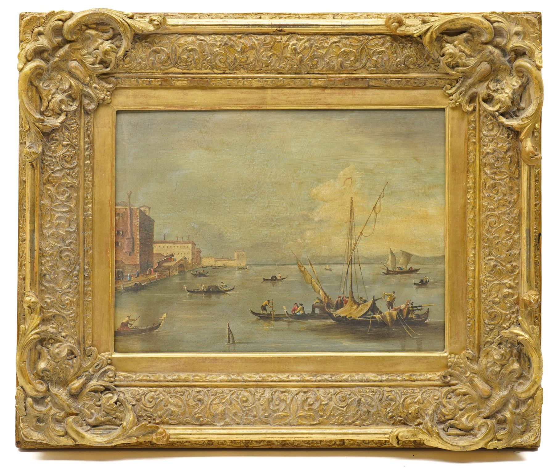 Follower of Francesco Guardi (Italian 1712-1793): Venice - the Fondamenta Nuove with the Lagoon and Island of San Michele, 19th century oil on panel unsigned 29cm x 39cm, in 19th century giltwood and gesso ornately moulded frame, overall 52cm x 62cm