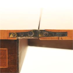 Regency mahogany fold-over tea table, rounded rectangular top with gateleg action, inlaid and crossbanded frieze, raised on squared tapering supports on brass castors