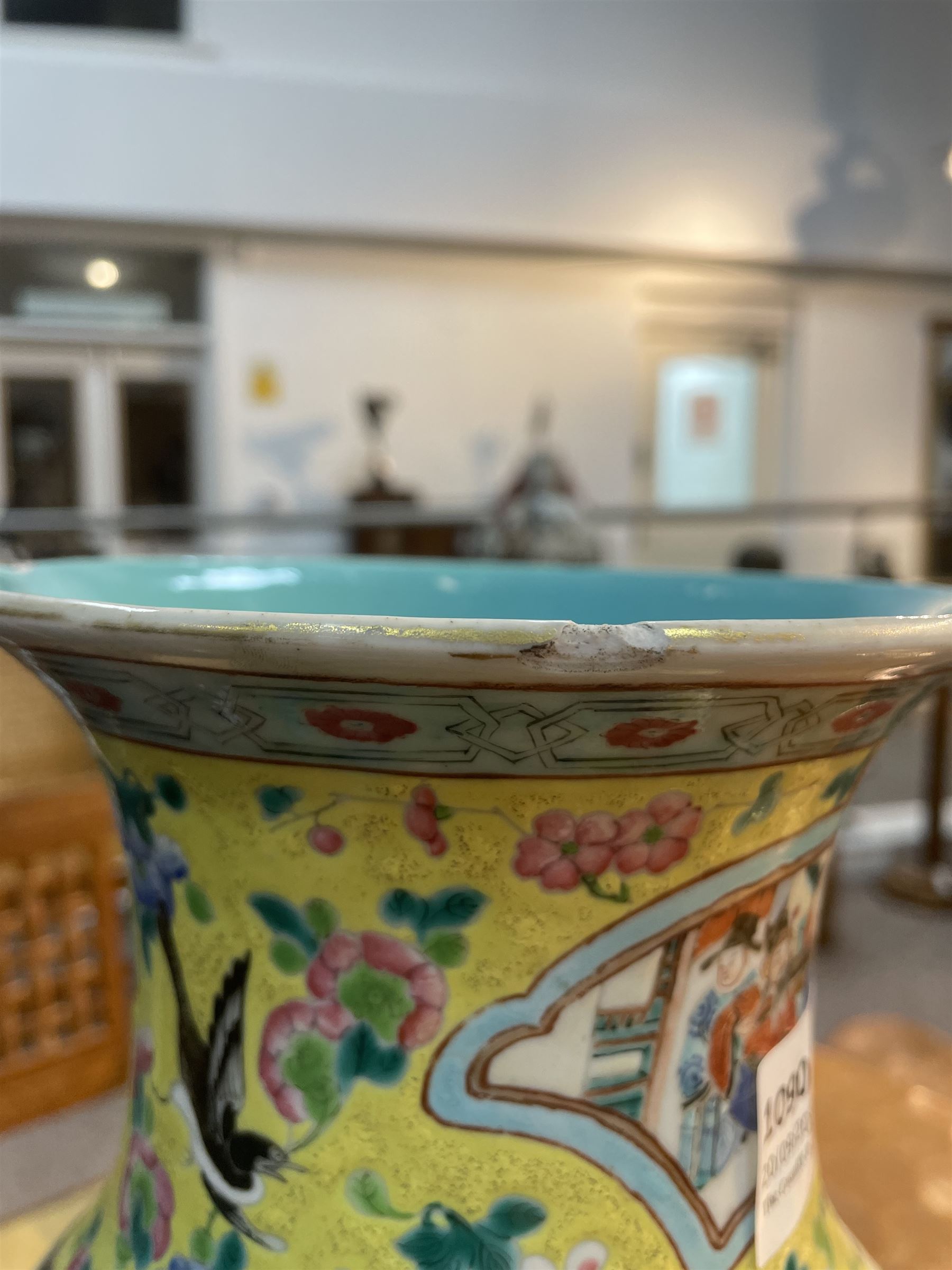 19th century Chinese famille rose yellow ground porcelain vase, of baluster form with twin applied mask ring handles, the body decorated with two shaped reserves mounted with dragon heads, depicting warriors at battle and at court, the neck with two smaller conforming figural reserves, upon a yellow ground decorated with exotic birds amidst scrolling blossom, H45.cm