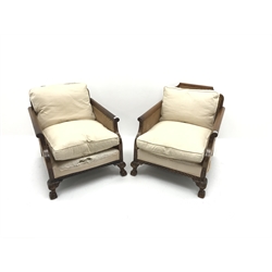  Pair early 20th century walnut Bergere armchairs, double cane work, acanthus carved cabriole legs on hairy paw feet, W75cm  