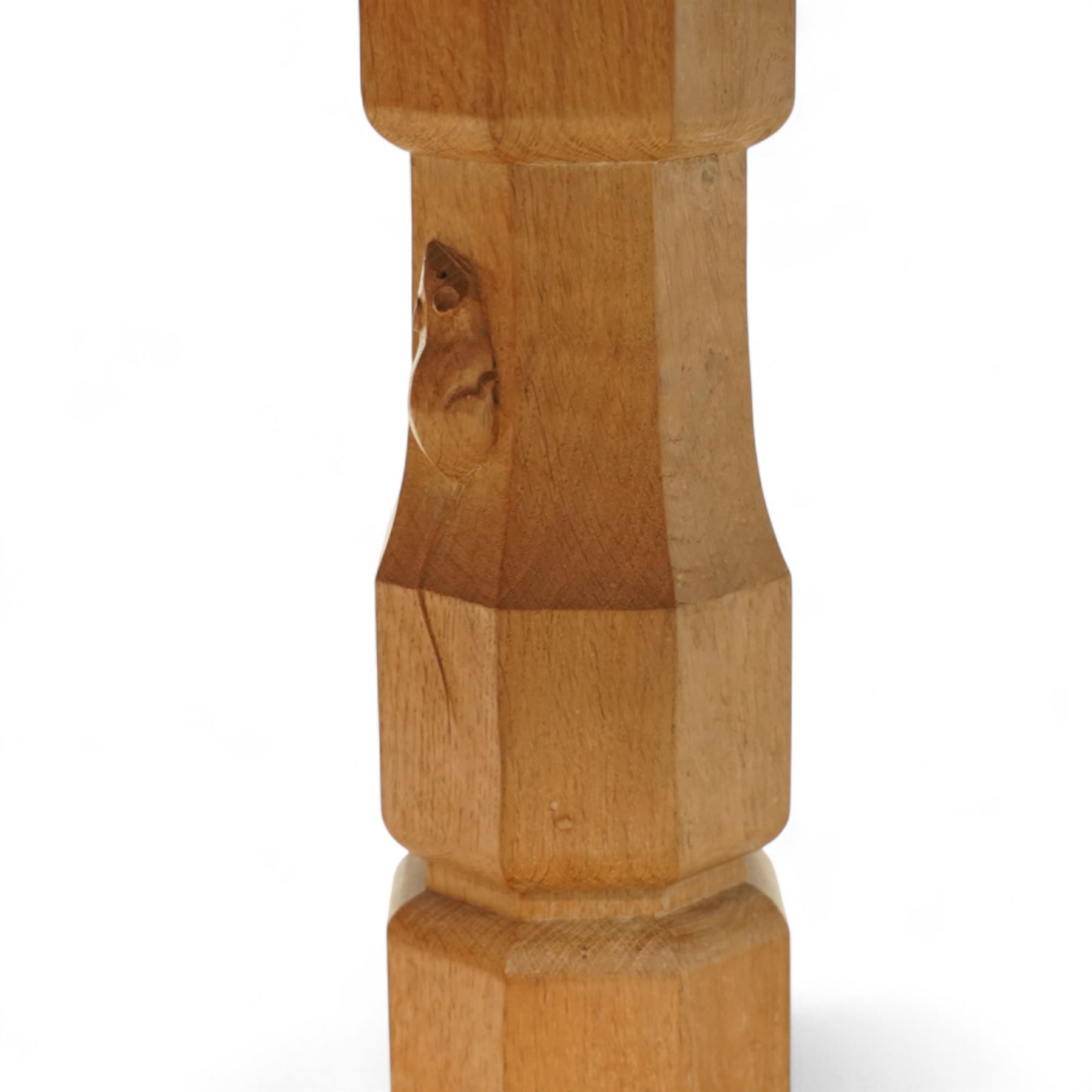 Mouseman - figured oak 5’ refectory dining table, rectangular top with burr figuring, raised on chamfered octagonal supports united by a stretcher, carved mouse signature to leg, by the workshop of Robert Thompson, Kilburn