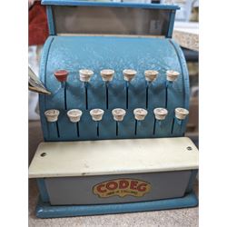 Codeg child's cash register, boxed, a 1930's Societe Nobel Francaise (SNF) doll and another vintage doll