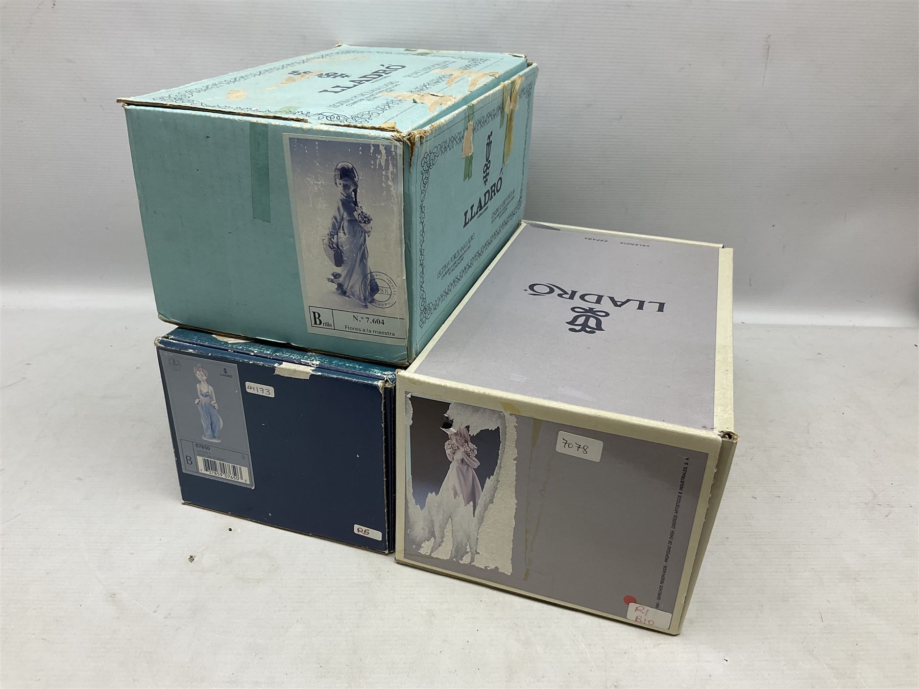Three Lladro figures comprising, Pocket Full of Wishes no 7650, School Days no 7604 and Spring Bouquets no 7603, all with original boxes, largest example H26cm  