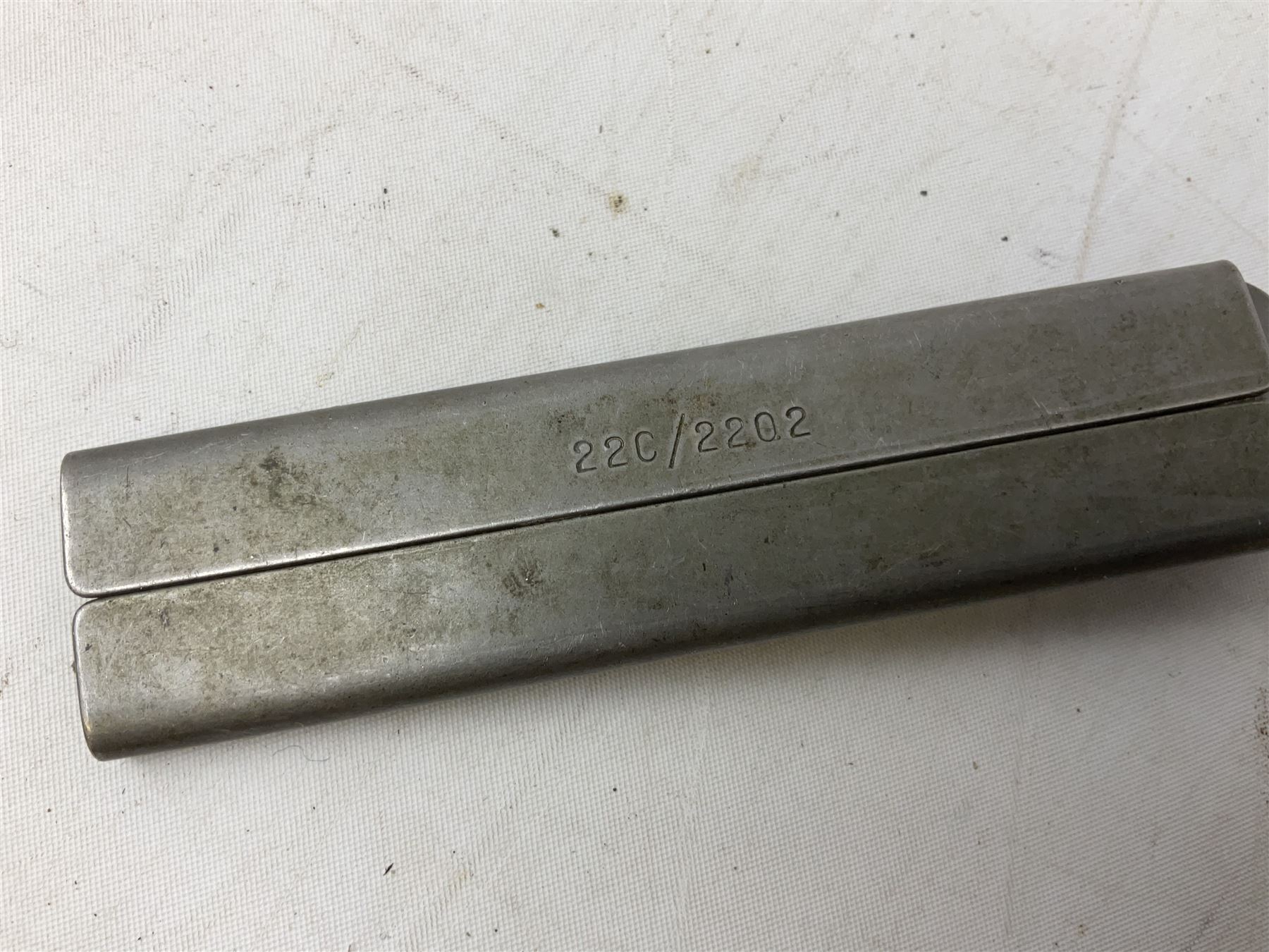Royal Air Force aircrew survival knife with 10cm Bowie style steel blade marked 'Joseph Rodgers Sheffield England 22C/1996', black grips with twin-sided locking mechanism and lanyard hole to cross-piece; steel scabbard marked 22C/2202 L23cm overall (with photocopies of modern reference material)