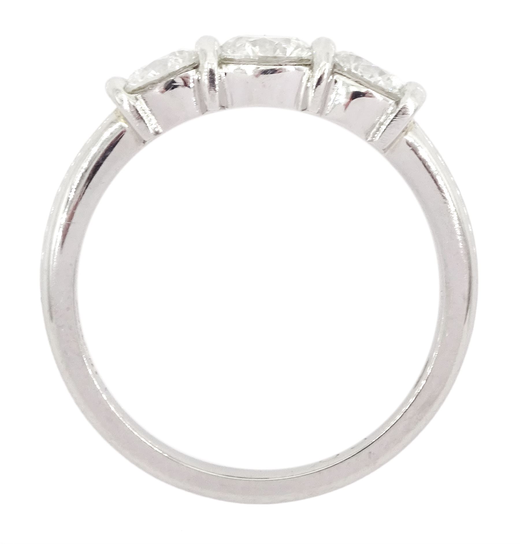 Platinum three stone round brilliant cut diamond ring by FEU, London 2003, total diamond weight 1.03 carat